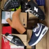 The photo shows a package with footwear in the category BS.