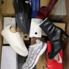 The photo shows a package with footwear in the category BS.