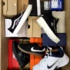 The photo shows a package with footwear in the category BS.