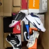 The photo shows a package with footwear in the category BS.