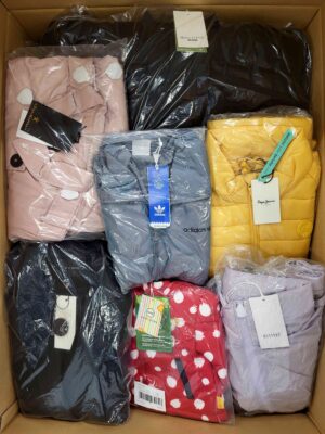 The photo shows a package with clothing in the category AJS.
