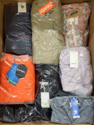 The photo shows a package with clothing in the category AJS.
