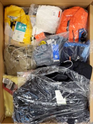 The photo shows a package with clothing in the category AJS.