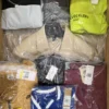 The photo shows a package with clothing in the category AM.