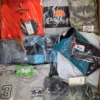 The photo shows a package with clothing in the category AM.