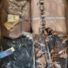 The photo shows a package with clothing in the category AJW.