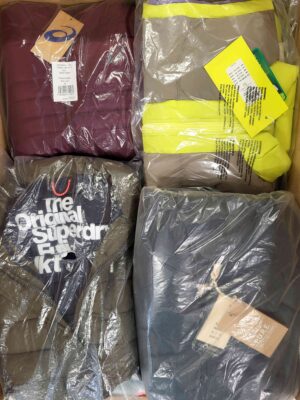 The photo shows a package with clothing in the category AJW.