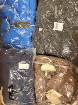 The photo shows a package with clothing in the category AJW.
