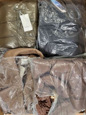 The photo shows a package with clothing in the category AJW.