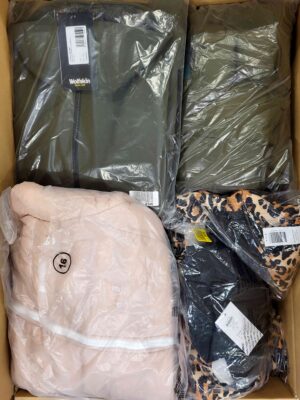 The photo shows a package with clothing in the category AJW.