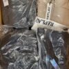 The photo shows a package with clothing in the category AJW.