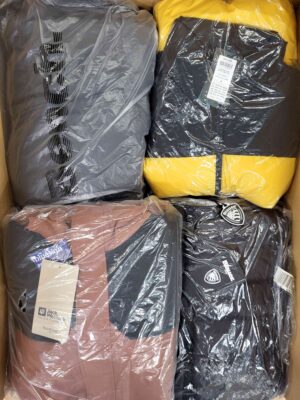 The photo shows a package with clothing in the category AJW.