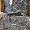 The photo shows a package with clothing in the category AJW.