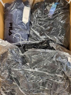 The photo shows a package with clothing in the category AJW.