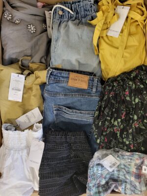 The photo shows a package with clothing in the category TSC.