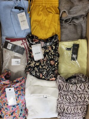 The photo shows a package with clothing in the category TSC.