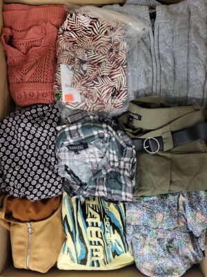 The photo shows a package with clothing in the category TSC.