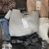 The photo shows a package with clothing in the category TSC.