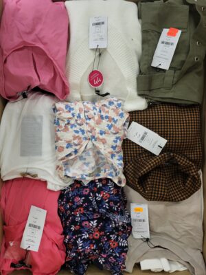 The photo shows a package with clothing in the category TSC.