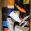 The photo shows a package with footwear in the category CS.