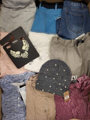 The photo shows a package with clothing in the category TSC.