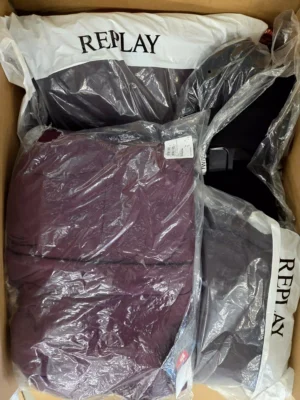 The photo shows a package with clothing in the category AJW.