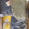 The photo shows a package with clothing in the category AJW.