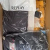 AJW794 1 The photo shows a package with clothing in the category AJW.
